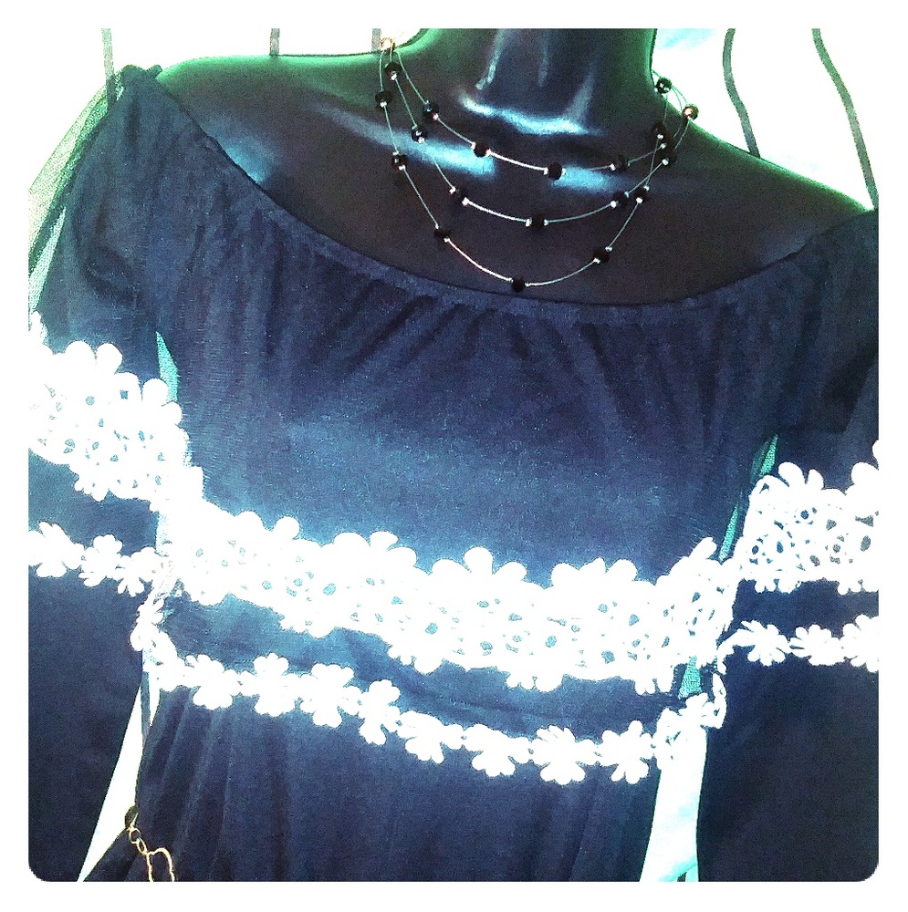 Beautiful All Black jumpsuit, with a lace neckline